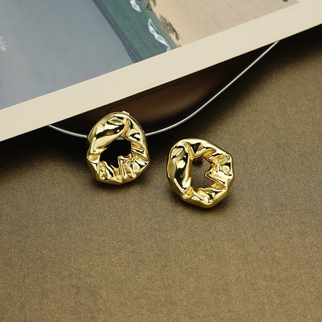 Vintage solid color irregular hollow hoop copper stud earrings wholesale NHGI628412's discount tags