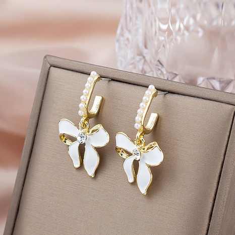 Fashion drop oil bow pearl sweet elegant alloy earrings's discount tags