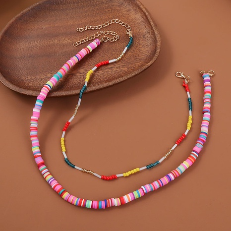 Bohemian creative beaded soft pottery multi-layer necklace's discount tags
