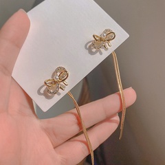 Fashion pearl bow tassel long new alloy earrings
