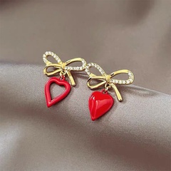 Korean style heart shaped hollowed bows alloy stud earrings wholesale
