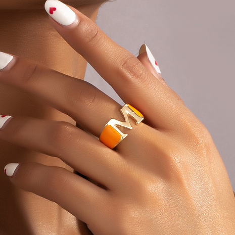 fashion drop oil hollow M letter orange alloy ring female's discount tags