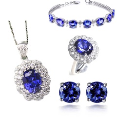 Ensemble de bijoux Bracelet géométrique Anneau de pétale de tanzanite Pendentif en cristal bleu Boucles d'oreilles à quatre griffes