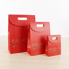 Bolsa de papel de regalo de estilo chino rojo directo de fábrica, embalaje festivo creativo, bolsa de asas de velcro al por mayor