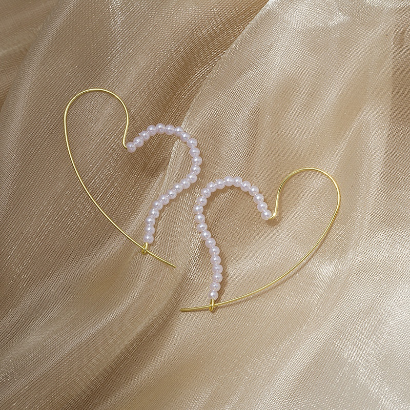 Boucles doreilles mignonnes simples de perle en forme de coeur de mode