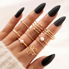 fashion geometric pearl inlaid flower spiral hollow alloy ring eight-piece set