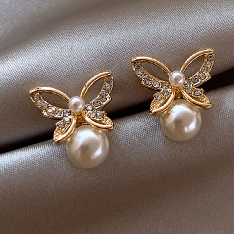 Japanese and Korean New Hollow Butterfly Studs Simple Graceful Pearl ThreeDimensional Butterfly Studs Korean Style Hot Selling Earringspicture1