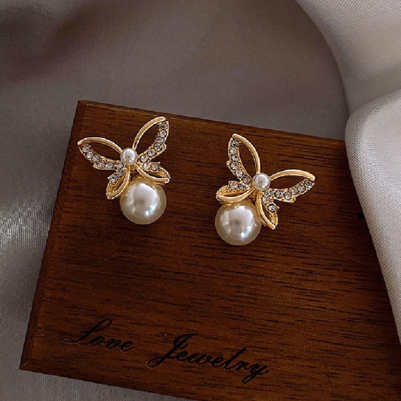 Japanese and Korean New Hollow Butterfly Studs Simple Graceful Pearl ThreeDimensional Butterfly Studs Korean Style Hot Selling Earringspicture2