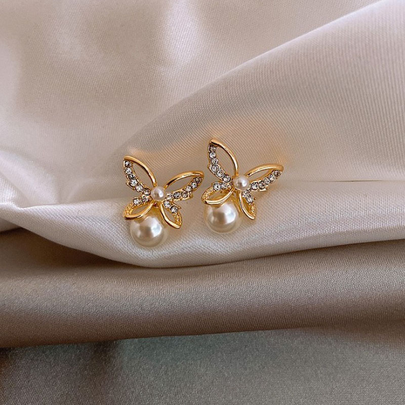 Japanese and Korean New Hollow Butterfly Studs Simple Graceful Pearl ThreeDimensional Butterfly Studs Korean Style Hot Selling Earringspicture3