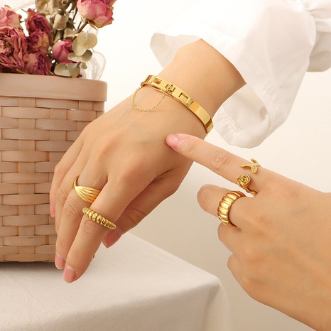 Joyería de moda cadena borla hebilla titanio acero plateado 18K oro pulsera pareja mano joyería's discount tags