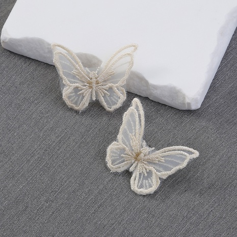 Women's Fashion White Butterfly Geometric Alloy Stud Earrings 's discount tags