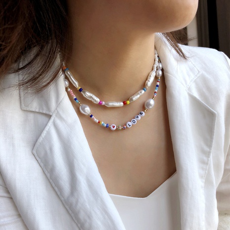Combinaisons européennes et américaines empilées lettres de bijoux transfrontaliers amour collier de perles de forme spéciale femelle chaîne de clavicule de perles de riz de couleur créative's discount tags