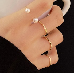 Conjunto de cuatro piezas de anillo de aleación de unión torcida de onda de perla simple de moda
