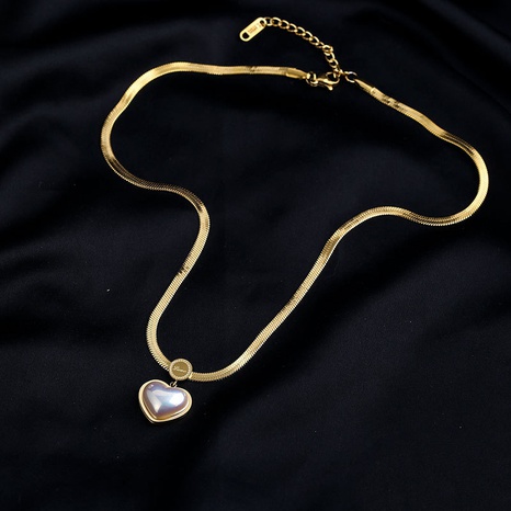 Collar de acero de titanio con colgante en forma de corazón de perlas con incrustaciones de moda simple's discount tags