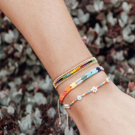 Fashion bohemian simple glass beads beaded daisy rainbow bracelet's discount tags