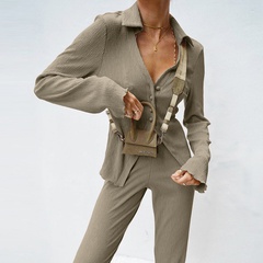 Nueva moda manga larga solapa cuello en v botón Delgado color sólido superior y conjunto de pantalones