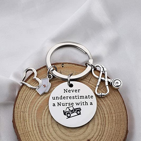 Nurse's Day Gift Never Underestimate Lettering Stainless Steel heart shape nurse cap stethoscope Keychain's discount tags