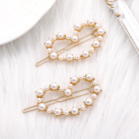 Fashion Simple Pearl Inlaid Hollowed Heart Shape Gold Hairpin's discount tags
