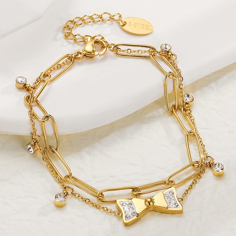 Fashion Zircon Inlaid Bow Pendant 14K Gold Plated Titanium Steel Bracelet's discount tags