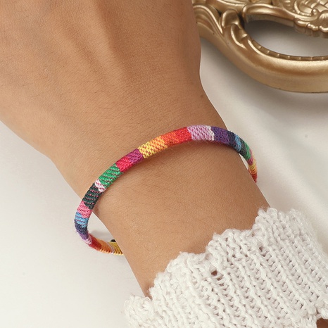 Pulsera de arcoíris tejida con cuentas hechas a mano's discount tags