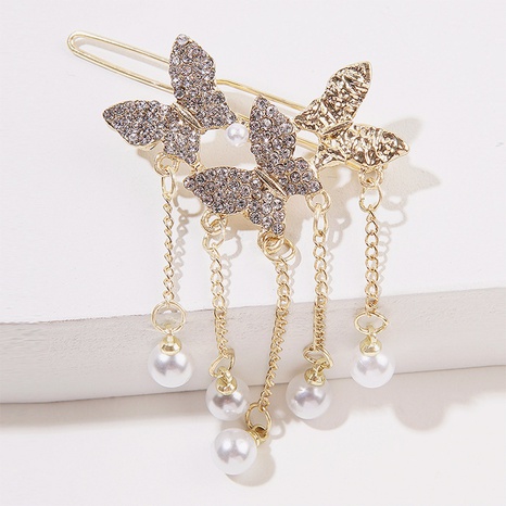 Fashion Summer New Tassel Butterfly Pearl Pendant Side Clip's discount tags