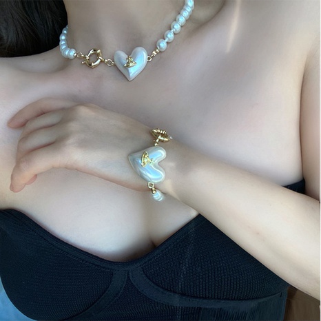 Collar de aleación con colgante de Saturno de flor de perlas Retro de moda's discount tags