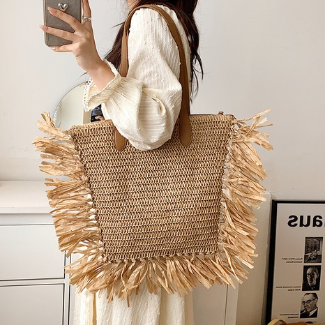 2022 Summer Stylish Tassel Large Capacity One-Shoulder Portable Bucket Weaving Bag's discount tags