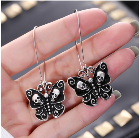 Fashion Simple Oil Dripping Skull Butterfly Earrings Insect Alloy Ear Hook's discount tags