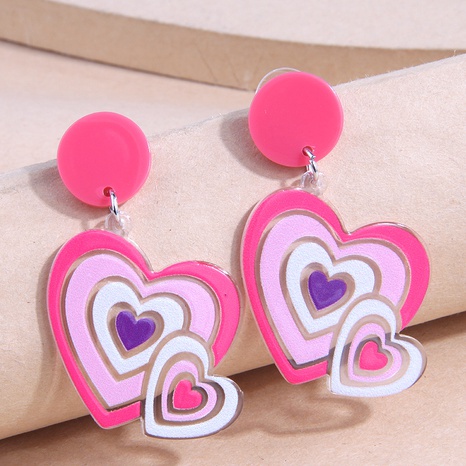 Pendientes lindos de plástico con forma de corazón rosa de moda's discount tags