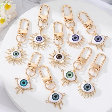 Alloy Base Support Diamond-Embedded Colorful Devil's Eye Keychain Gold Electroplated Resin Patch Handbag Pendant's discount tags