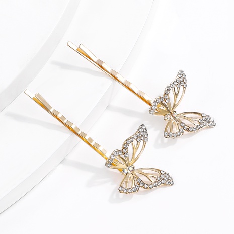 Nueva pinza de pelo de palabra elegante Simple de mariposa de diamantes de imitación hueca de aleación dorada's discount tags