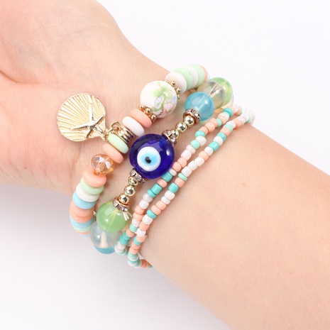 Fashion New Shell Blue Devil's Eye Glass Beads Elastic Beaded Combination Set Bracelet's discount tags