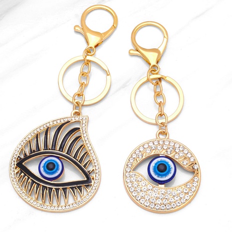 new Creative golden Pendant devil’s eye inlaid rhinestone alloy Key chain's discount tags