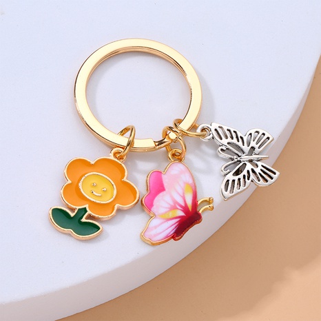 Colorful Alloy Bee Hive Hanging Piece Pendant Flower Butterfly Bag Decorative Keychain's discount tags