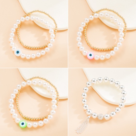 Einfacher Stil Teufels Auge Künstliche Perle Harz Metall Perlen Quaste Armbänder's discount tags