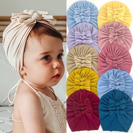 Children Unisex Fashion Solid Color Bow Knot Baby Hat's discount tags
