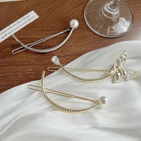 Simple Style Bow Knot Metal Pearl Hair Clip's discount tags