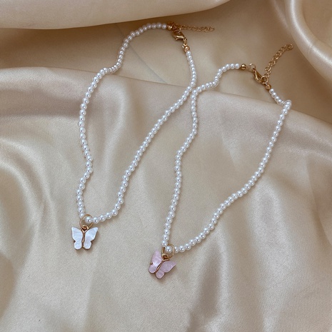 Simple Style Bow Knot Imitation Pearl Inlay Shell Necklace's discount tags