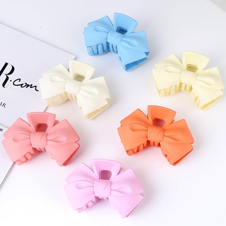 Sweet Solid Color Bow Knot Plastic Hair Claws's discount tags